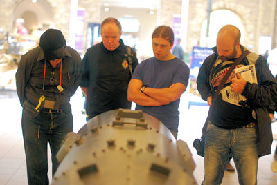 Men looking at canons