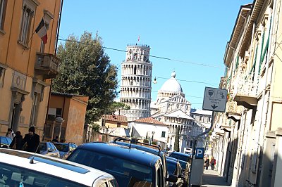 The straight tower in Pisa - notice the leaning street and Cathedral. 